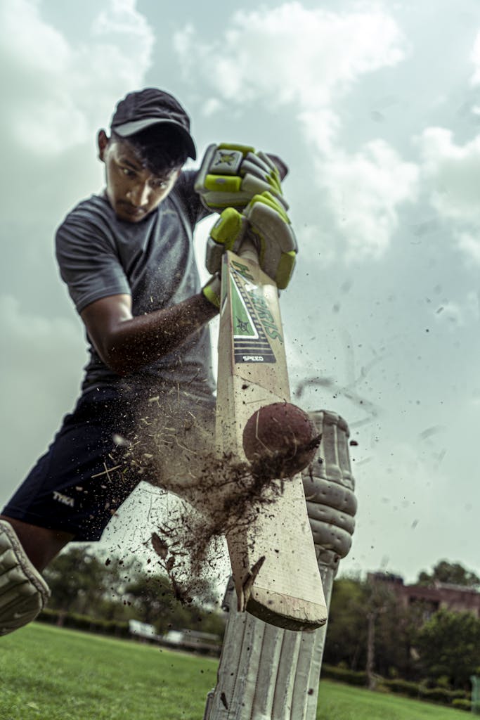 Low Angle Shot of Man Playing Cricket