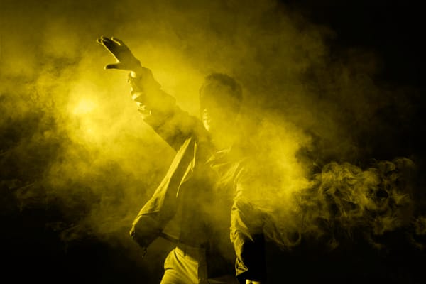 smoke sesh - man dancing in smoke with illuminating light