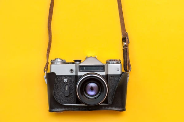 retro camcera on yellow background
