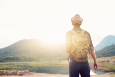 man backpacking