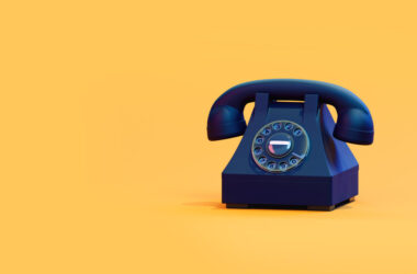 Photo black retro phone on a yellow background. 3d illustration
