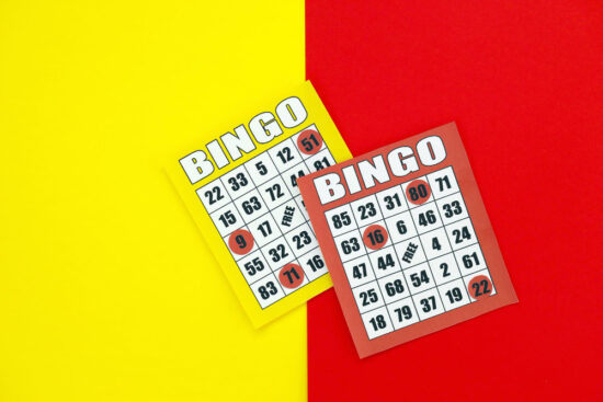 Yellow and red bingo boards or playing cards for winning chips classic us or canadian five to five bingo cards on bright background