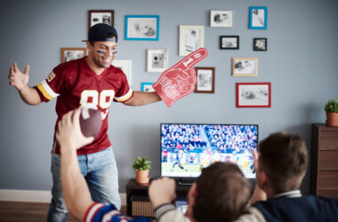 group of friends watching football at home