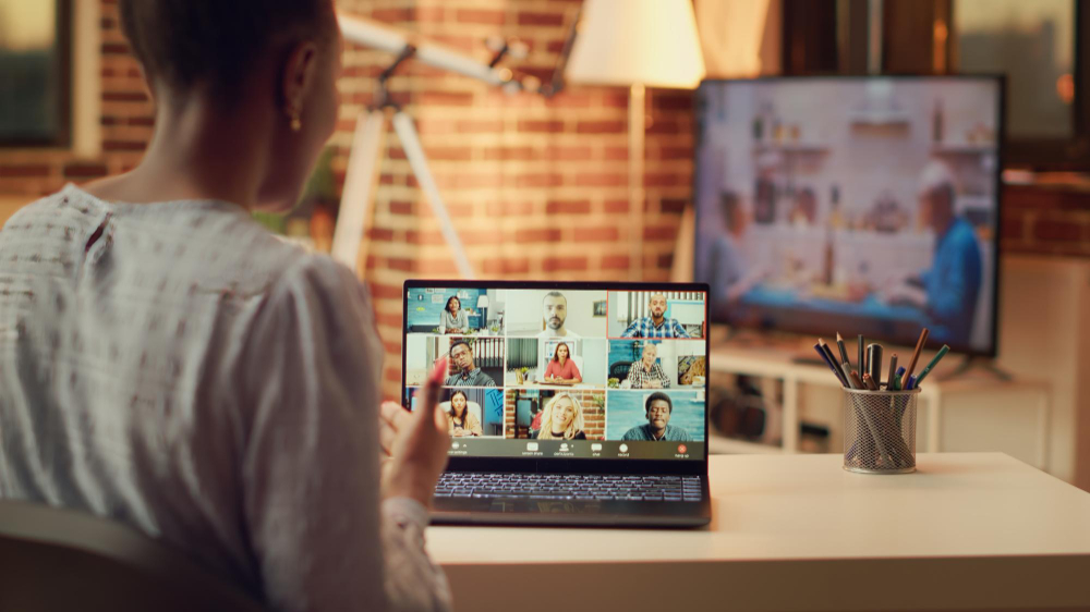 Photo woman attends videocall meeting with partners online, discussing about important freelancing tasks to finish. teleworker talking to contractor on telework chat, remote job at home.
