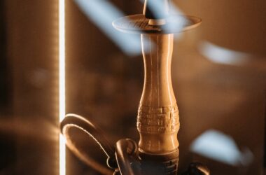 Brass and Black Hookah on Brown Wooden Table