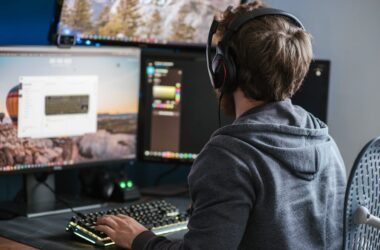 Unrecognizable man working on computer at home