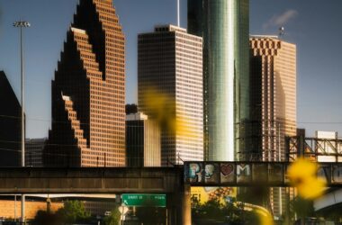 Capture of Houston's downtown skyline at sunset, showcasing modern architecture.